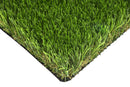 Colorado artificial grass corner showing green blades, tan thatch and black backing