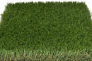 Florida 80 artificial grass sample showing the green turf surface and tan thatch along the edge